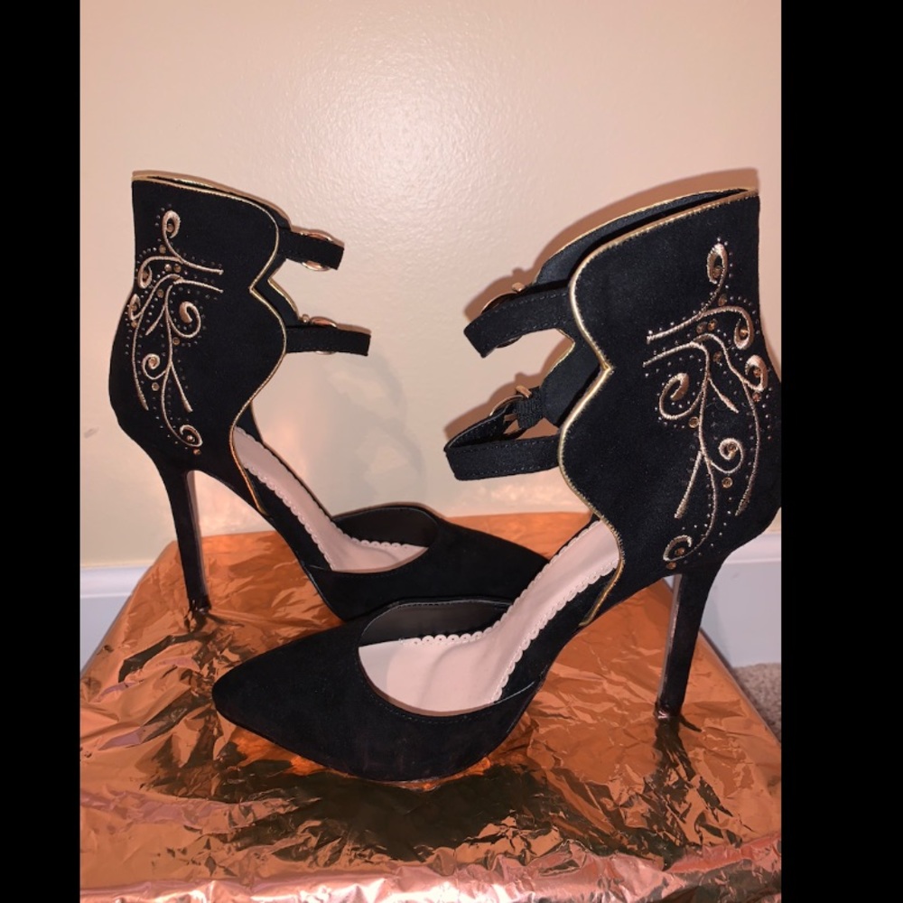 Gold and black stilettos